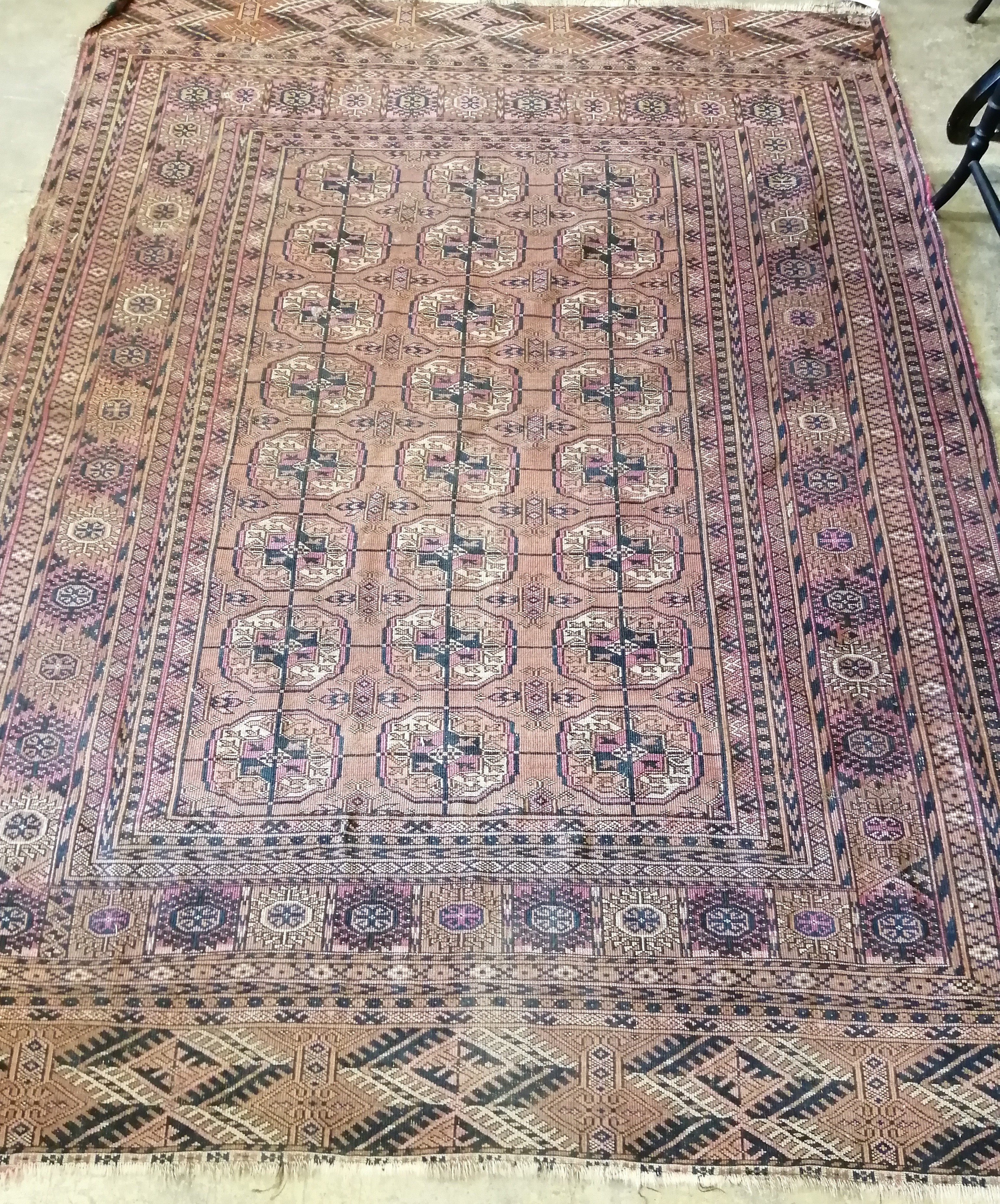 A Bokhara red ground rug, 200 x 148cm